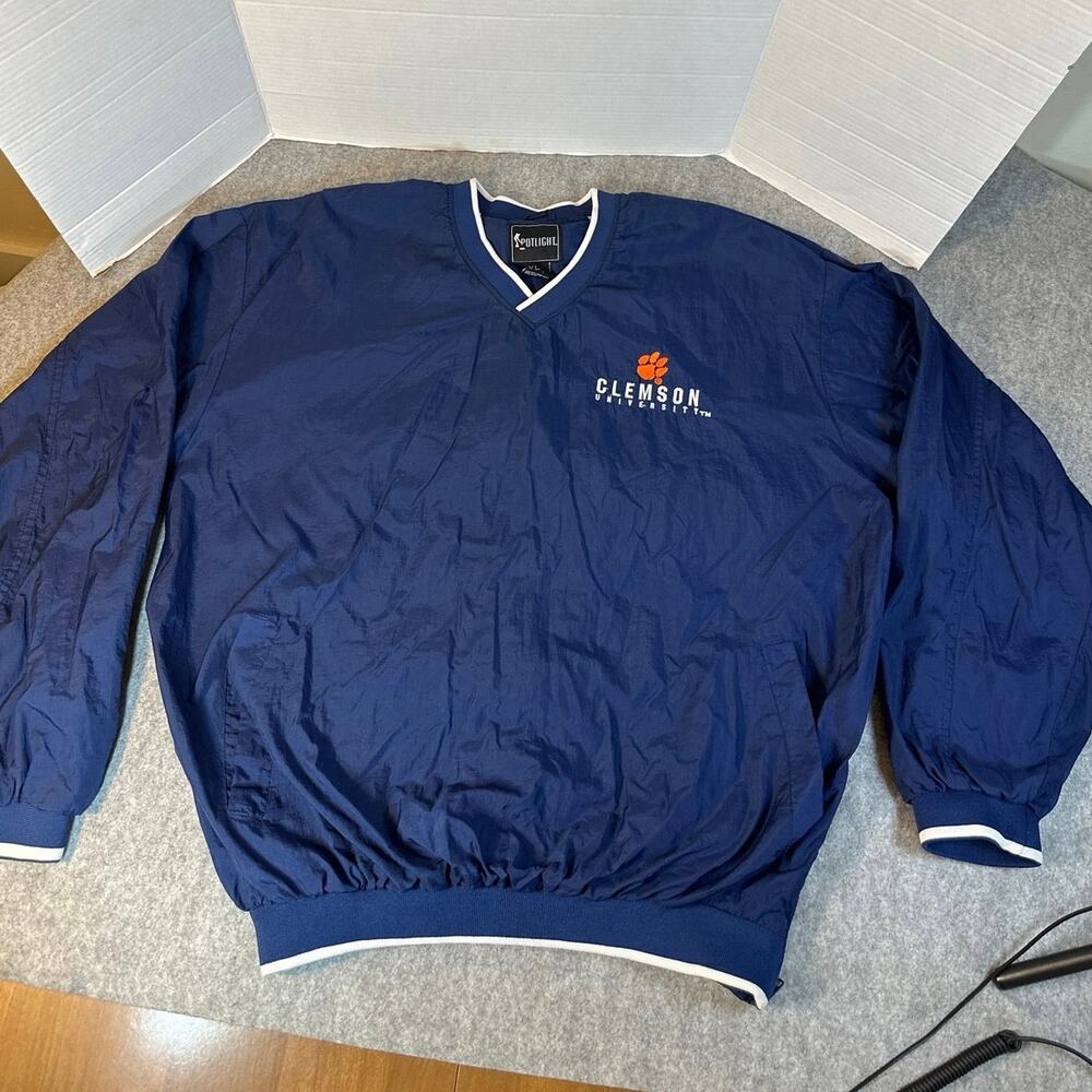 Spotlight Clemson University pull over windbreaker in navy blue w/white trim.